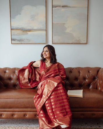 RED PURE BANARASI SILK SAREE WEAVED WITH COPPER ZARI COMES WITH ATTACHED BLOUSE.