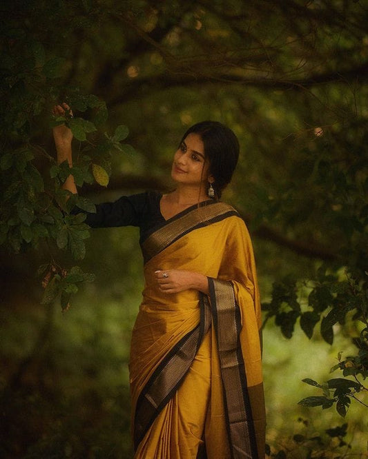 SYMMETRICAL YELLOW & BLACK PURE SOFT SILK SAREE WITH ENGROSSING BLOUSE PIECE