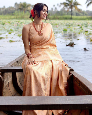 PHENOMENAL LIGHT ORANGE SOFT BANARASI SILK SAREE WITH IMBRICATION BLOUSE PIECE
