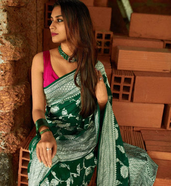 QUITESSENTIAL DARK GREEN SOFT BANARASI SILK SAREE WITH MAGNIFIC BLOUSE PIECE