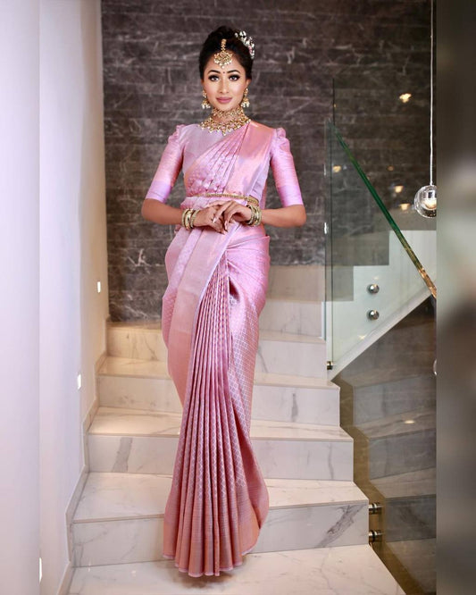 STUNNING BABY PINK SEMI SILK SAREE WEAVED WITH GOLDEN ZARI COMES WITH HEAVY BROCADE BLOUSE.