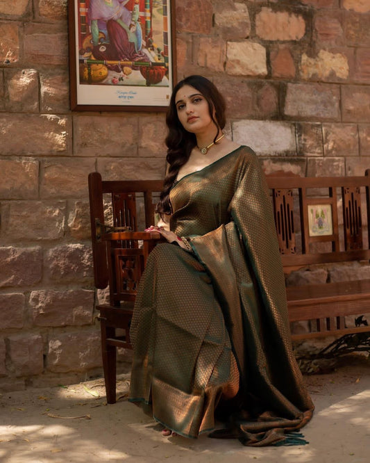 Engaging Dark Green Soft Silk Saree With Elaborate Blouse Piece
