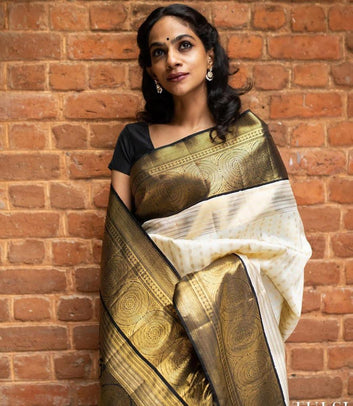 Vestigial Off White Soft Silk Saree With Symmetrical Blouse Piece