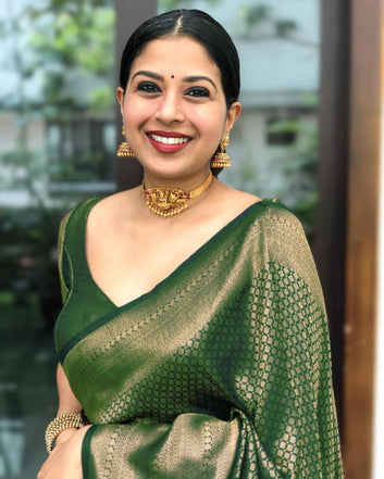Flamboyant Green Soft Silk Saree With Gleaming Blouse Piece